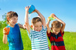 Preschool boys pouring water
