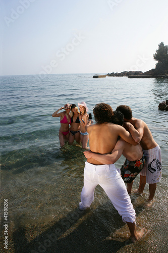 Photo: Friends taking holiday snaps in the sea Friends taking holiday snaps in the sea