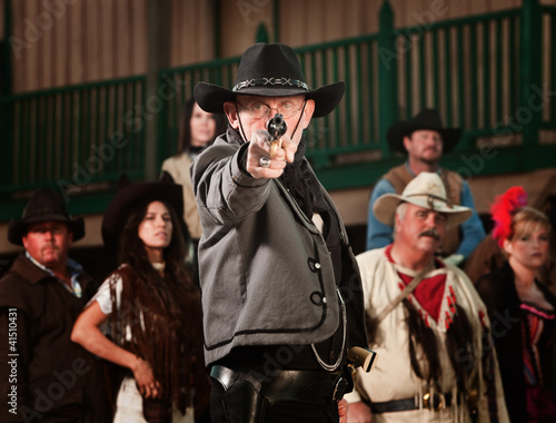 Photo: 1800's western sheriff with gun drawn at point blank range 1800's western sheriff with gun drawn at point blank range