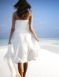Girl walking on a white sandy beach on the Maldives (Malediven)
