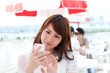 Foto: Beautiful young woman using a mobile phone Beautiful young woman using a mobile phone