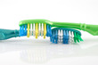Two tooth-brushes over white Two tooth-brushes over white