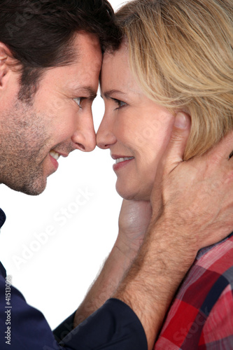 Photo: Couple with noses together Couple with noses together