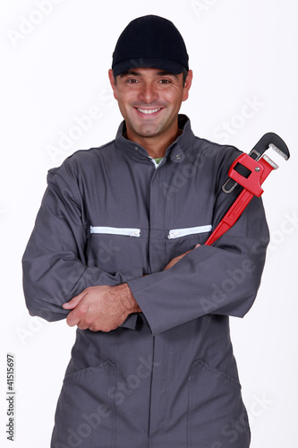 Photo: mechanic holding a spanner mechanic holding a spanner