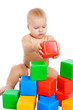 Little baby playing with cubes