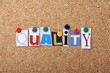 The word Quality in letters pinned to a cork board