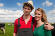 Typical Dutch landscape with farmer couple and cows Typical Dutch landscape with farmer couple and cows
