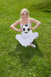 Pretty woman holding a football