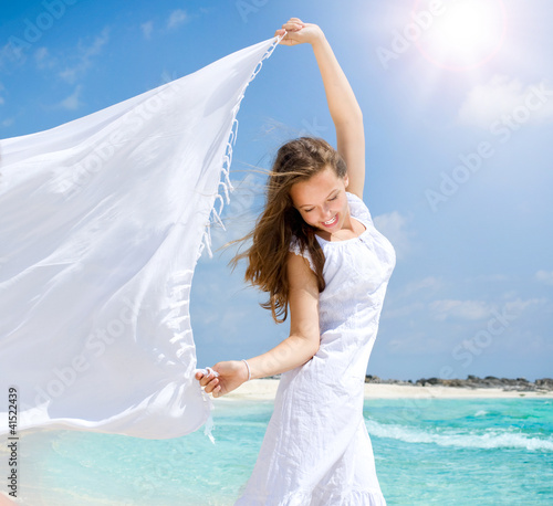 Photo: Beautiful Girl With White Scarf on The Beach Beautiful Girl With White Scarf on The Beach
