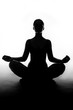 Silhouette of woman sitting in lotus position Silhouette of woman sitting in lotus position