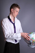 Young man with globe in his hands.