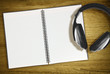 open notebook and headphones