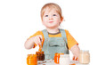Boy with little jars of baby food