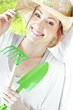 Photo: portrait of young woman with gardening tools portrait of young woman with gardening tools