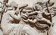 Femme et Cupidon, bas relief de pierre. Femme et Cupidon, bas relief de pierre.