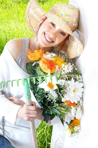 Photo: woman with gardening tools woman with gardening tools