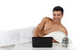 Photo: Nepalese young man in bed, laptop Nepalese young man in bed, laptop