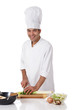 Photo: Attractive nepalese chef male, leek Attractive nepalese chef male, leek