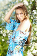 beautiful woman standing near the apple tree beautiful woman standing near the apple tree