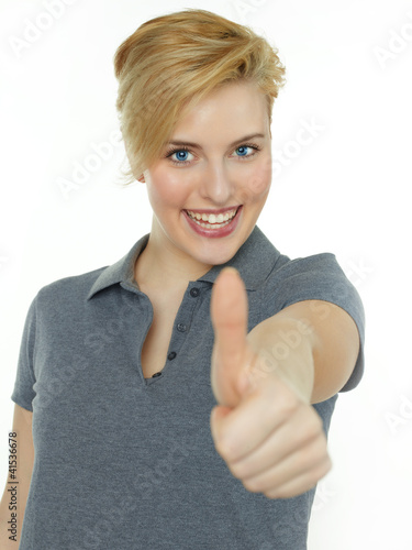 Photo: Happy successful woman shows thumb up on white background Happy successful woman shows thumb up on white background