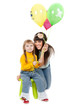 studio shot of mother and daughter with balloons