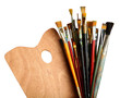 Brushes with a palette isolated on white