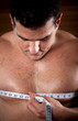 Man measuring his chest