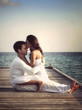 Beautiful love couple on a jetty by the sea (Maldives)