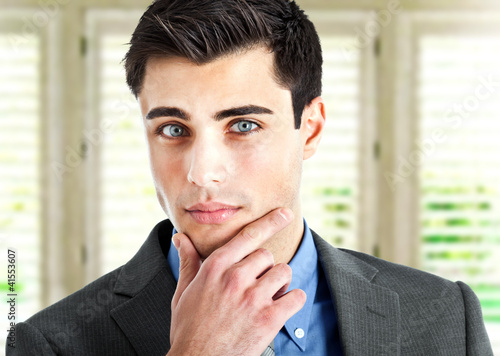 Photo: Thoughtful businessman portrait Thoughtful businessman portrait