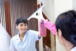 Photo: Asian woman cleaning up bathroom mirror Asian woman cleaning up bathroom mirror
