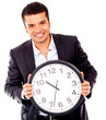 Business man holding a clock