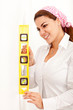 Woman holding level instrument