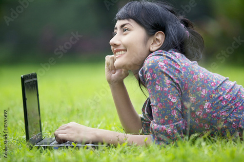 Photo: Casual business woman with laptop Casual business woman with laptop