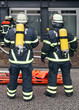 Feuerwehrmänner mit Sauerstoff-Flaschen Feuerwehrmänner mit Sauerstoff-Flaschen