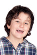 Smiling child without a toothbrush