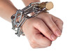 Two hands securely tied by metal chain isolated on white