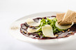 Vegetarian carpaccio with beetroot,nuts and toast
