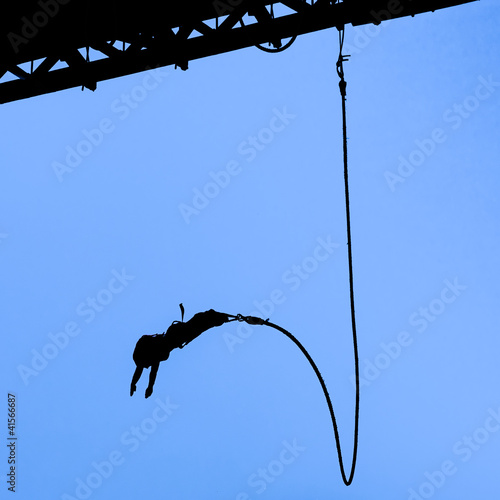 Photo: Bungee jumper against blue sky Bungee jumper against blue sky