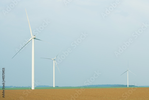 Photo: Wind turbines in plowed field Wind turbines in plowed field