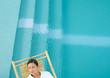 Woman sleeping in lounge chair next to pool