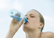 Woman drinking bottled water