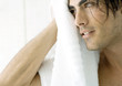 Man drying off face with towel
