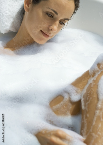 Photo: Woman taking bubble bath Woman taking bubble bath