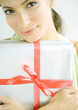 Woman holding present in arms