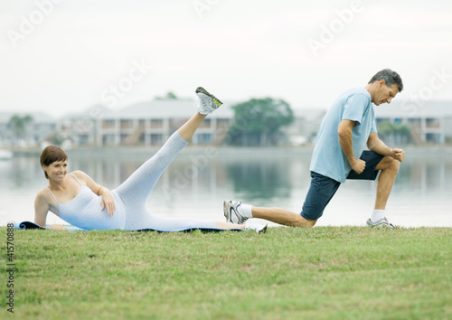 Photo: Mature couple exercising, lakeside Mature couple exercising, lakeside