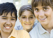 Three preteen kids smiling