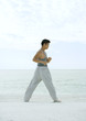 Man stretching on beach