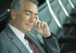 Businessman sleeping in airport lounge
