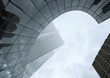 Skyscraper with reflection of buildings on facade, low angle, abstract view