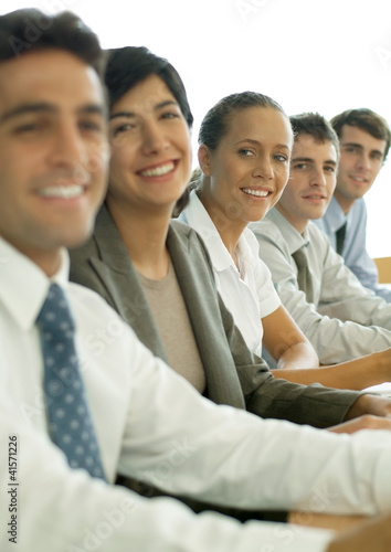 Photo: Business colleagues having meeting, focus on woman Business colleagues having meeting, focus on woman